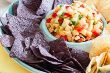 Chips and bowl of Cantaloupe Salsa