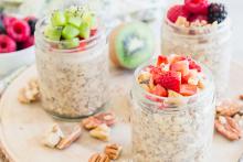 Overnight Oats with Almond Butter and Fruit in jars topped with fresh fruit