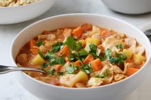 Bowl of sweet potato, peanut, cabbage, African stew